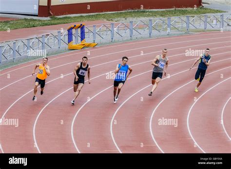 Running Men Athletes At Sprint Distance Of 200 Meters During Ural