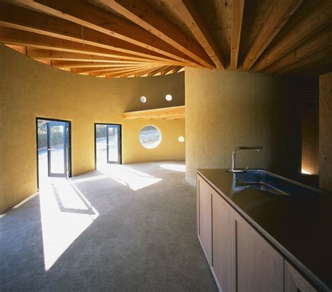 This Rammed Earth Home Has A Spiral Rooftop Garden