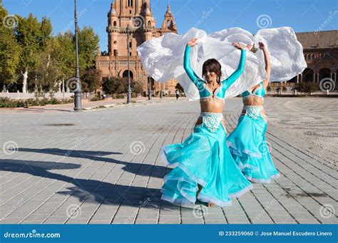 Two Young And Beautiful Belly Dancers Dancing In A Square They Are