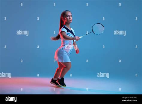 High Up Beautiful Dwarf Woman Practicing In Badminton Isolated On Blue