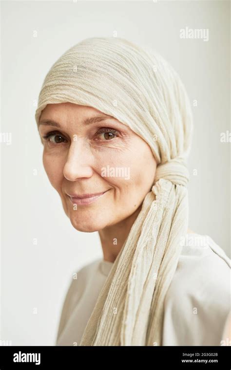 Minimal Headshot Portrait Of Beautiful Mature Woman Wearing Headscarf