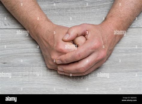 The Hands Of A Waiting Man Stock Photo Alamy