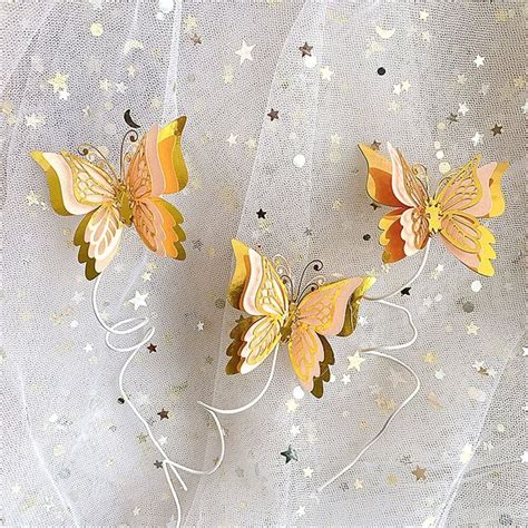 Two Yellow Butterflies With Stars On Them Are Attached To A Net Curtain