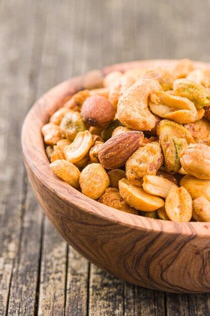 Premium Photo Spicy Flavoured Nuts Mix Of Nuts In Bowl