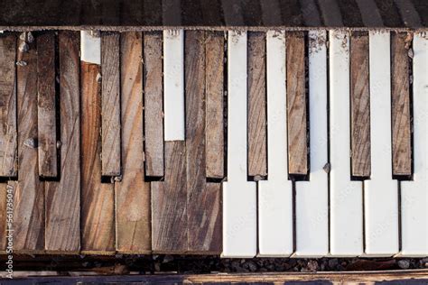 Old broken piano. Keyboard with broken, peeled piano keys. Stock Photo ...