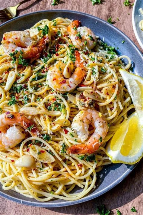 Shrimp Scampi Pasta Without Wine Served On A Dark Blue Grey Plate With