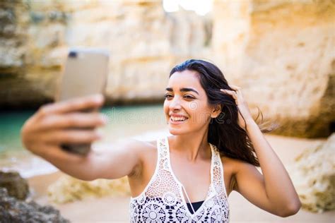 Beautiful Latin Girl Take Selfie On Phone At Beautiful Caves Beach Near