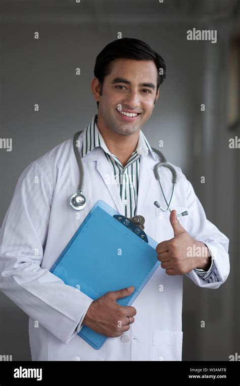 Portrait Of A Male Doctor Showing Thumbs Up Sign Stock Photo Alamy