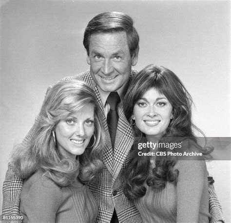 American Game Show Host Bob Barker Poses Flanked By Two Of The