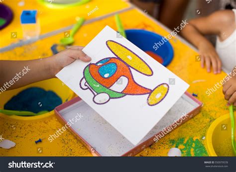 Child Draws Colored Sand Picture Cartoon Stock Photo Edit Now 550979578