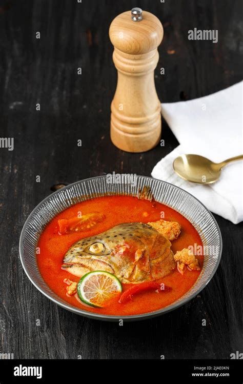 Salmon Fish Head Spicy Curry With Tomatoes And Herbs Gulai Kepala Ikan