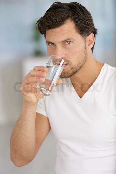 Man Drinking Water From A Glass Stock Image Colourbox