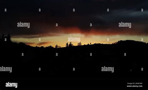 Sunset with dark storm clouds Stock Photo - Alamy