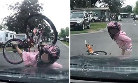 Moment Girl On Bike Crashes Head On Into Car But Is Saved By Her Pink