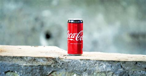 coca cola   brown concrete surface  stock photo