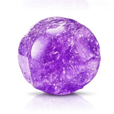 Um Objeto Em Forma De Diamante Roxo Manchas Brancas E Roxas Foto