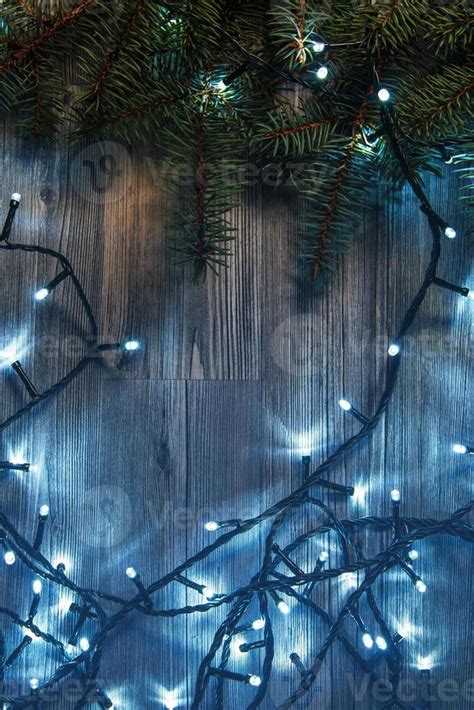 Christmas lights and branches of spruce 16295563 Stock Photo at Vecteezy