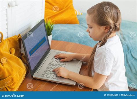 Child Using Laptop At Home Distance Learning And On Line Education