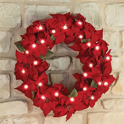 The 24 Cordless Prelit Poinsettia Wreath Hammacher Schlemmer