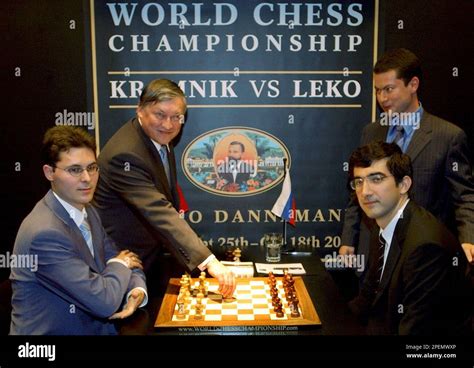 Former World Champion Anatoly Karpov Back Left Makes The First Move