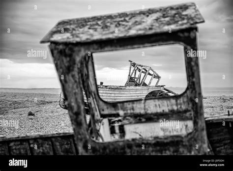 Abandoned Derelict Fishing Boats On Shingle Beach Landscape In Winter