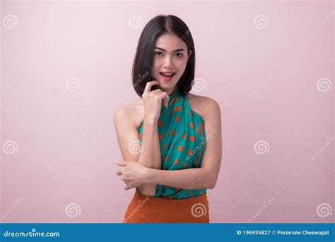 Cute Asian Woman In Color Casual Dress Thinking And Imagination