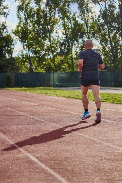 Man Running On A Running Track Stock Photo Image Of Modern Endurance