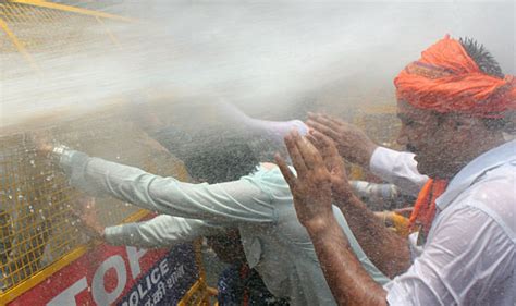 Police Fire Water Cannons At Congress Protesters