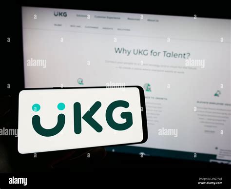 person holding mobile phone  logo   software company ultimate