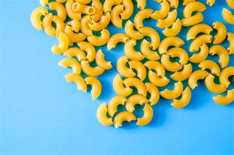 Premium Photo Directly Above Shot Of Raw Pasta On Blue Background