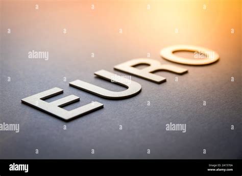 Word euro written with white solid letters on a board Stock Photo - Alamy