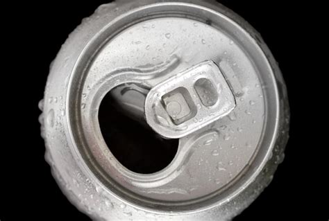 Premium Photo Aluminum Can With Water Drops Isolated On Black