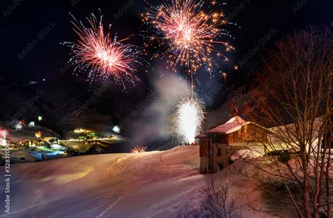 The Austrian Ski Resort Warth In The Snowy Alps With New Year Rockets