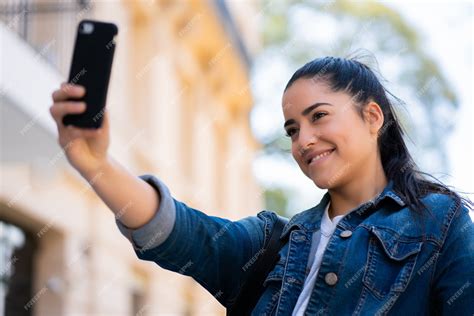 Free Photo Portrait Of Young Woman Taking Selfies With Her Mophile