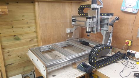 A Machine That Is Sitting On Top Of A Wooden Table In A Room With Wood Paneling