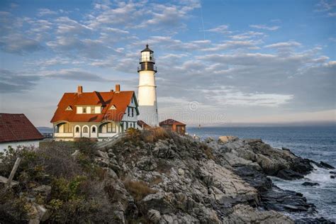 An Active Lighthouse On A Rocky Shore Of The Atlantic Ocean In The Rays