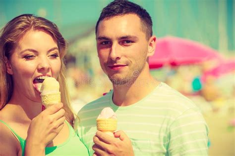 Man And Woman Eating Ice Cream On Beach Stock Photo Image Of Cream