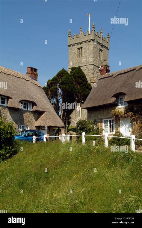 Thatched Cottages And Church At Godshill Isle Of Wight England Stock