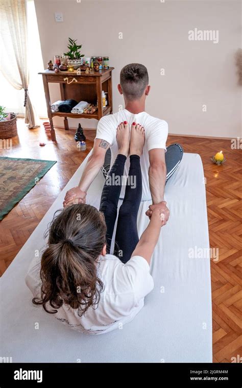 Professional Therapist Giving Traditional Thai Stretching Massage Stock