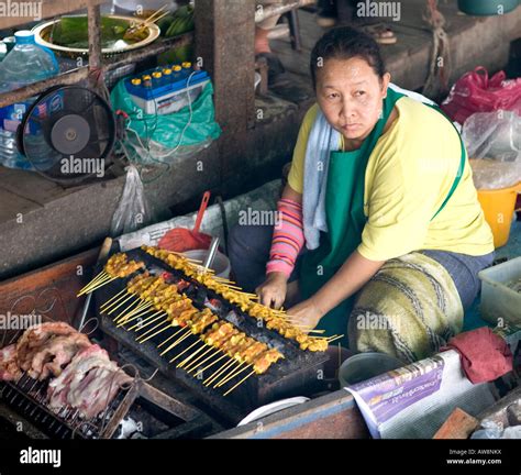 Women Cooking Chicken Satay In A Floating Market Bangkok Thailand South