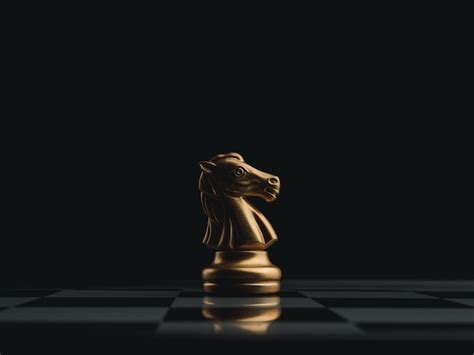 Premium Photo | The golden horse, knight chess piece standing alone on ...