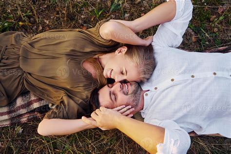 Happy Couple Is Outdoors Laying Down On The Ground 15460224 Stock Photo