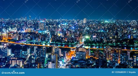 Panoramic Urban City Skyline Aerial View Under Twilight Sky And Neon