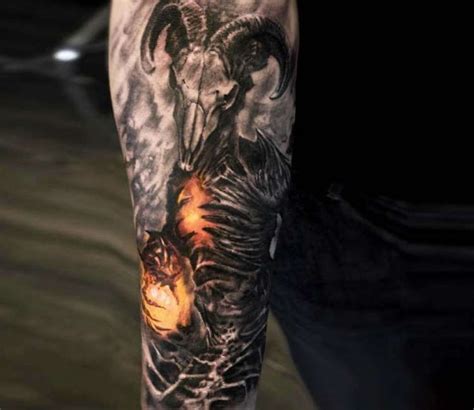 a man's arm with an animal and demon tattoo on it