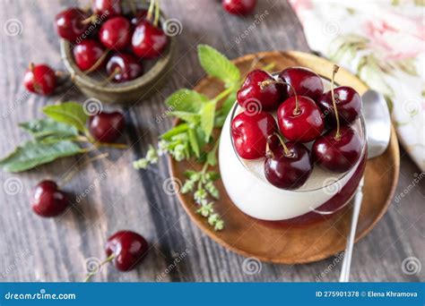 Panna Cotta With Sweet Cherry Jelly On A Rustic Table Italian Dessert