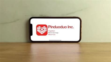 Pinduoduo logo displayed on mobile phone | Stock Video | Pond5