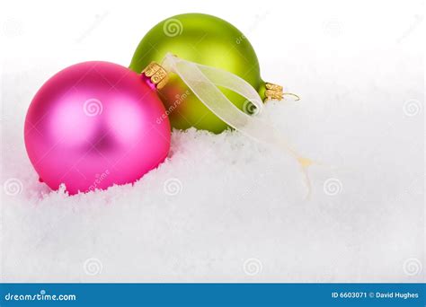 Christmas baubles on snow stock image. Image of bright - 6603071