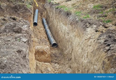 Trench for pipes stock image. Image of pipe, field, excavation - 130287431