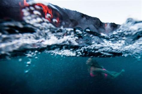 Adventurous Surfer Swims Near Erupting Volcano In Hawaii | Others