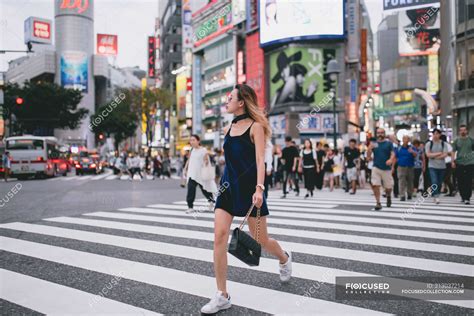 Young Lady Crossing The Streets In Tokyo Japan — Road Portrait